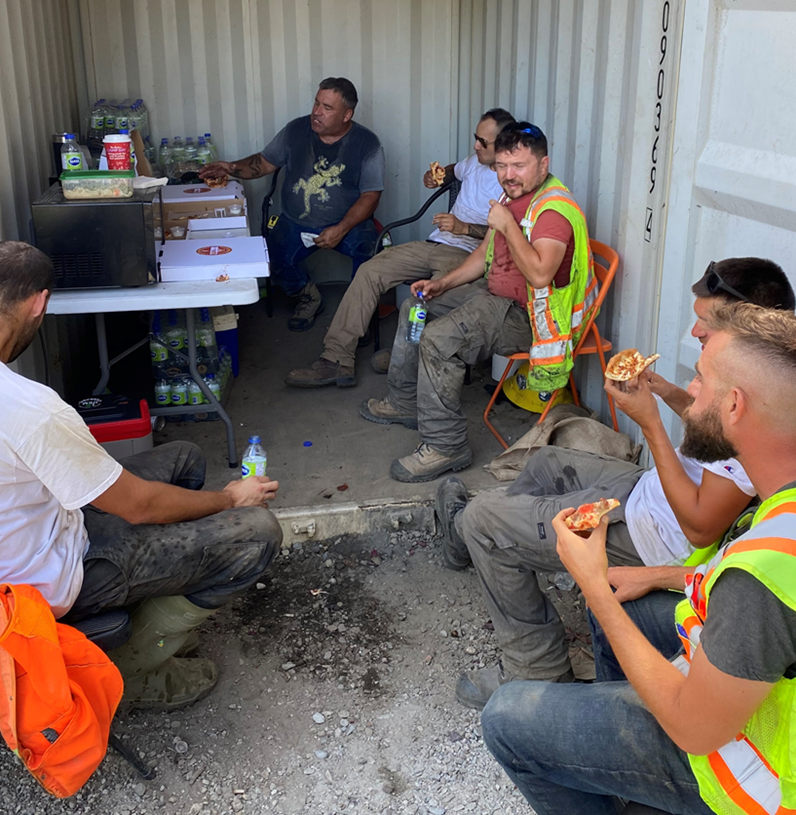 BEL Contracting crew eating pizza, a well-deserved reward for another safe job. 
